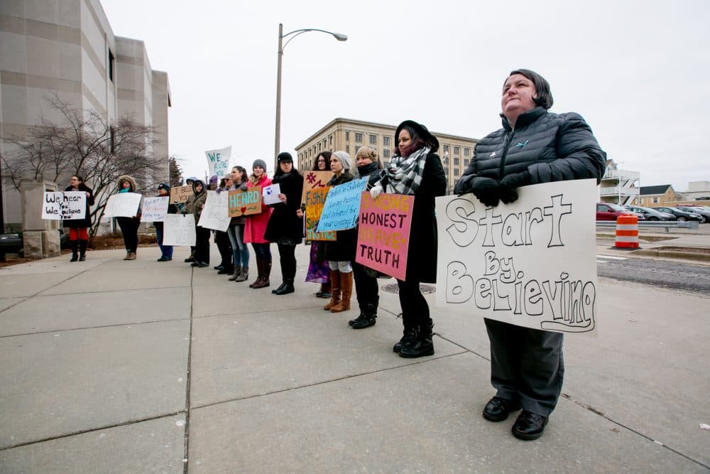 Women from the Michigan-based victim advocacy groups End Violent Encounters and Firecracker Foundation cheer for women as they leave the courthouse after the sentencing of Larry Nassar in Ingham County Circuit Court on Jan. 24, 2018 in Lansing, Mich. (Anthony Lanzilote/Getty Images)