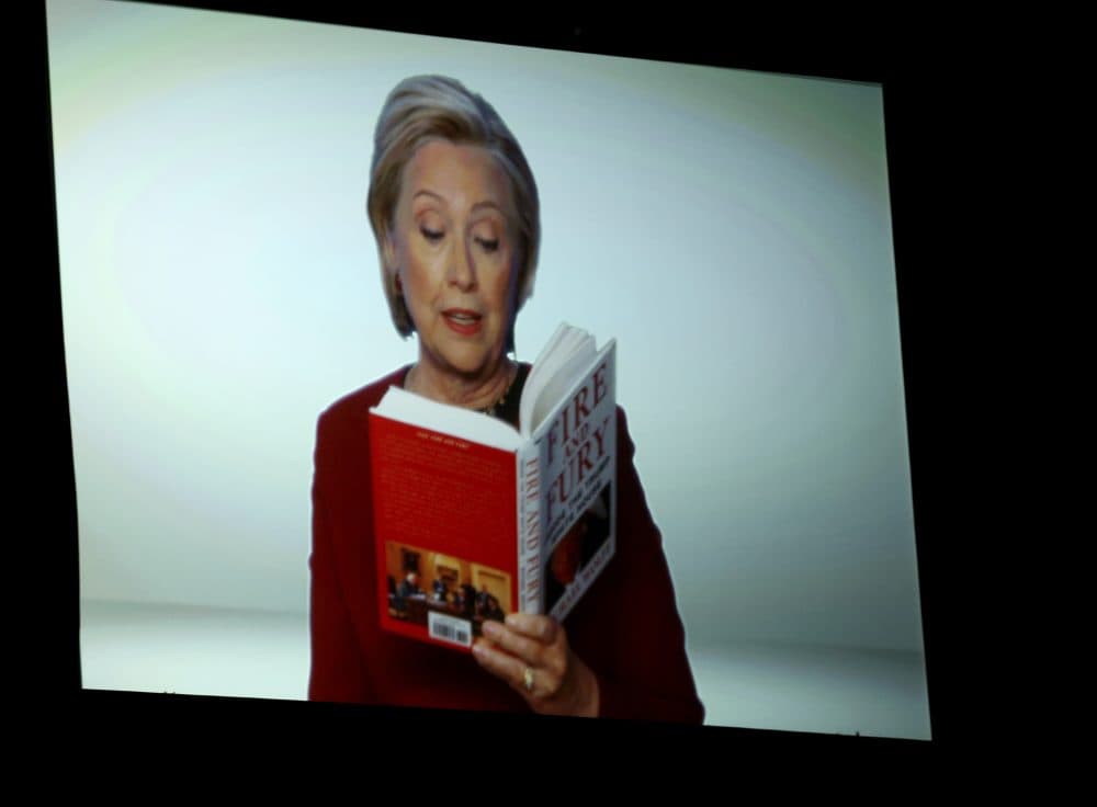 Hillary Clinton appears on screen reading an excerpt from the book &quot;Fire and Fury&quot; during a skit at the 60th annual Grammy Awards at Madison Square Garden on Sunday, Jan. 28, 2018, in New York. (Matt Sayles/Invision/AP)