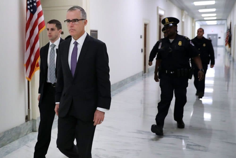 FBI deputy director Andrew McCabe (second from the left) is escorted by U.S. Capitol Police before a meeting with members of the Oversight and Government Reform and Judiciary committees in the Rayburn House Office Building Dec. 21, 2017 in Washington. (Chip Somodevilla/Getty Images)