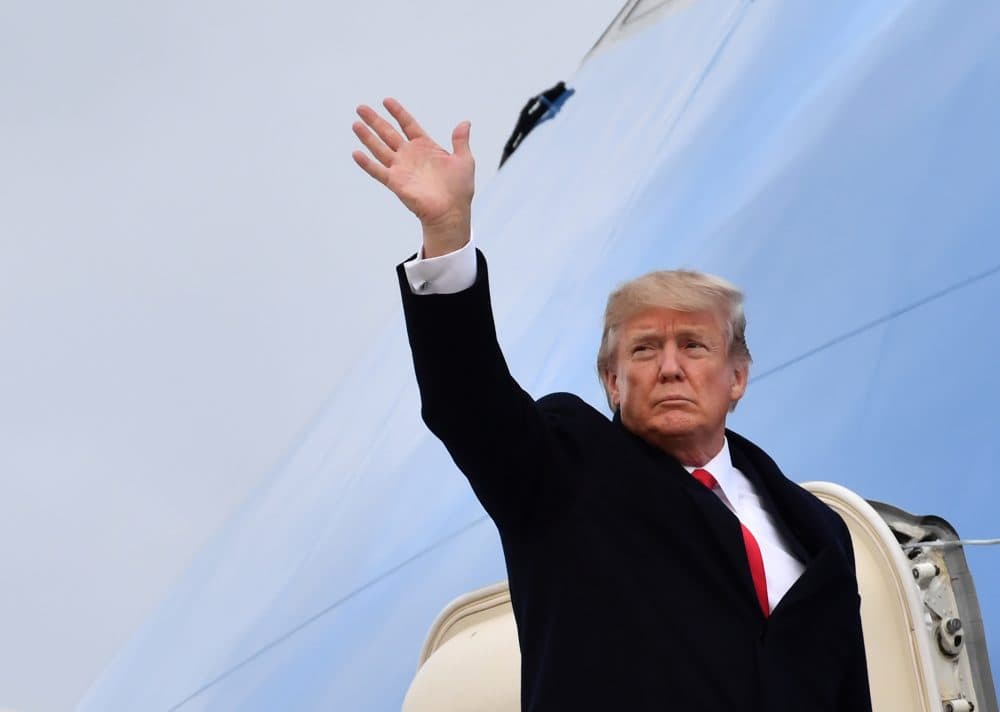 President Trump waves before boarding the Air Force One ahead of his departure from Zurich Airport in Zurich on Jan. 26, 2018, after attending the World Economic Forum annual meeting in Davos. (Nicholas Kamm/AFP/Getty Images)