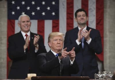 President Trump gestures as delivers his first State of the Union address in the House chamber of the U.S. Capitol to a joint session of Congress on Tuesday in Washington, as Vice President Mike Pence and House Speaker Paul Ryan applaud. (Win McNamee/Pool via AP)