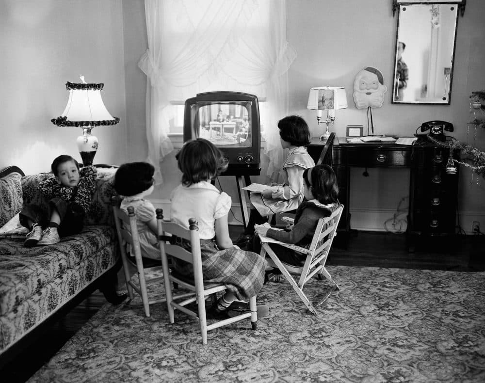 A new book argues that the key driver of American failure is not ideological so much as generational. In this Jan. 6, 1953, file photo, school children watch a teacher giving them a lesson via television at home in Baltimore, Md. (AP)