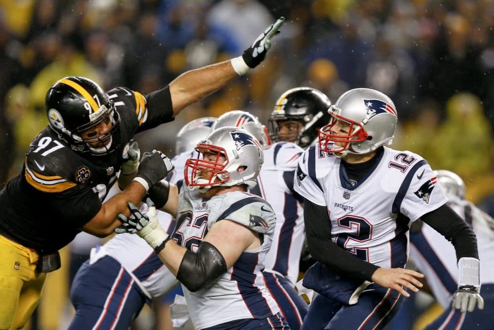 Pittsburgh Steelers defensive end Cameron Heyward (97) reaches in to New England Patriots quarterback Tom Brady (12) after he passed during the second half of an NFL football game in Pittsburgh, Sunday, Dec. 17, 2017. (Keith Srakocic/AP)