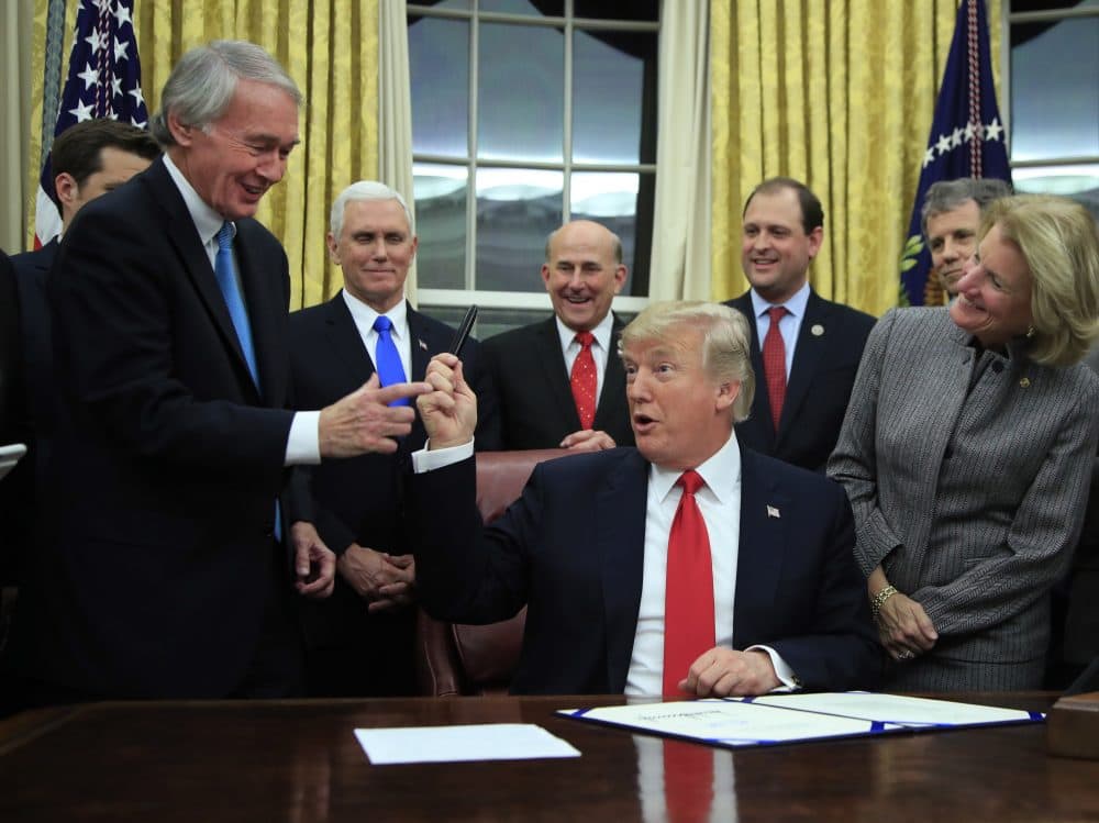 President Trump hands to Sen. Ed Markey the pen he used in signing into law Markey's bipartisan INTERDICT Act in 2018. (Manuel Balce Ceneta/AP)