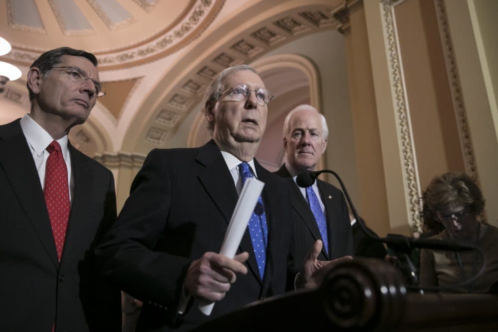 Senate Majority Leader Mitch McConnell, R-Ky., flanked by Sen. John Barrasso, R-Wyo., left, and Majority Whip John Cornyn, R-Texas, speaks to reporters about efforts to avoid a government shutdown this weekend, at the Capitol in Washington, Wednesday, Jan. 17, 2018. (J. Scott Applewhite/AP)