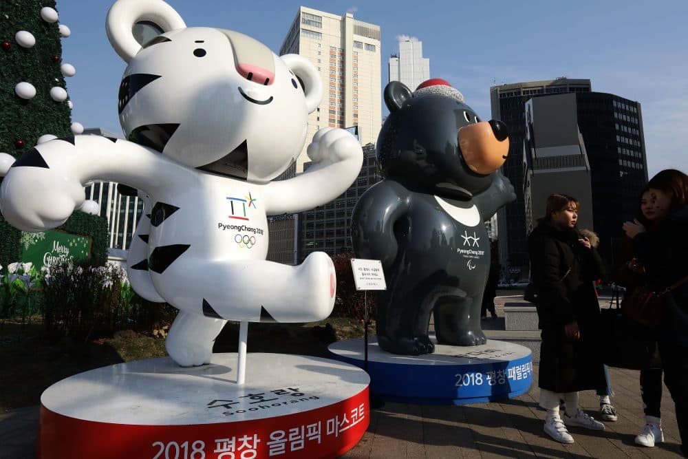 Pedestrians walk past mascots of the 2018 PyeongChang Winter Olympic and Paralympic Games in Seoul, South Korea. North Korea will march with South Korea in the Winter Olympics opening ceremonies. (Chung Sung-Jun/Getty Images)
