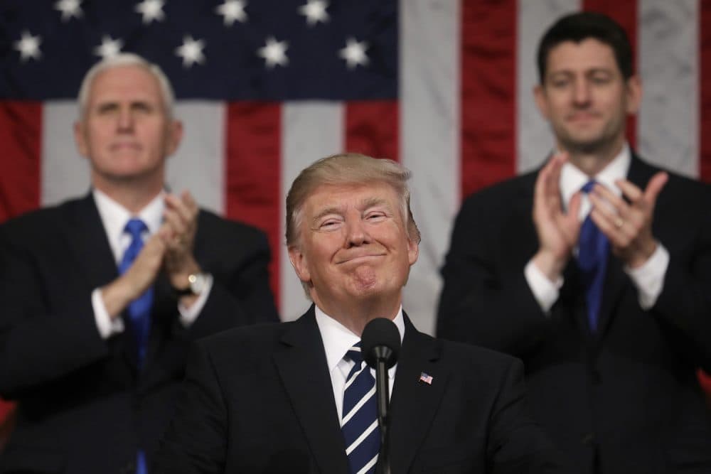President Donald Trump addresses a joint session of Congress on Capitol Hill in Washington, Tuesday, Feb. 28, 2017, as Vice President Mike Pence and House Speaker Paul Ryan of Wis., applaud. (Jim Lo Scalzo/Pool Image via AP)