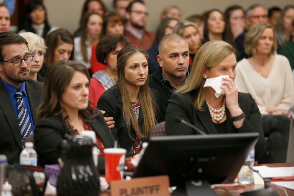 Kyle Stephens and others react as former Michigan State University and USA Gymnastics doctor Larry Nassar listens to impact statements on January 24th. More than 100 women and girls accuse Nassar of a pattern of serial abuse dating back two decades. (AFP/Getty Images)