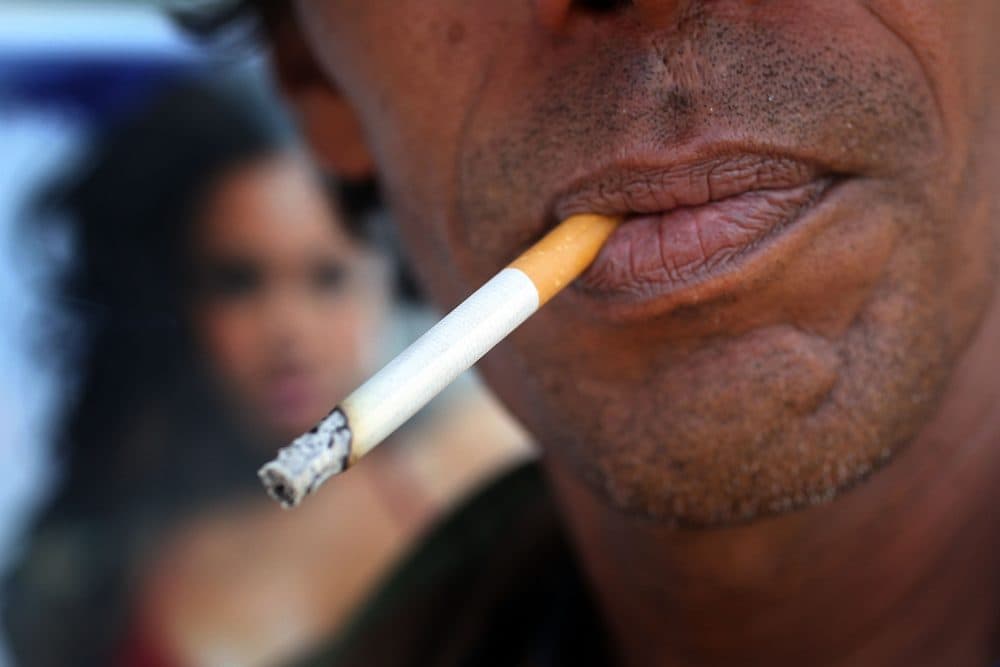 A man smokes a menthol cigarette in front of a Quick Stop store on March 30, 2010 in Miami. (Joe Raedle/Getty Images)