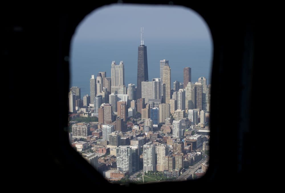 The Chicago skyline, including the John Hancock Center, is seen from the air through a helicopter window over Chicago in 2013. (Saul Loeb/AFP/Getty Images)