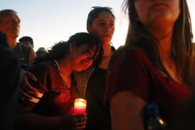 Students gather during a vigil at Pine Trails Park for the victims of the Wednesday shooting at Marjory Stoneman Douglas High School, in Parkland, Fla., Thursday, Feb. 15, 2018. (Brynn Anderson/AP)