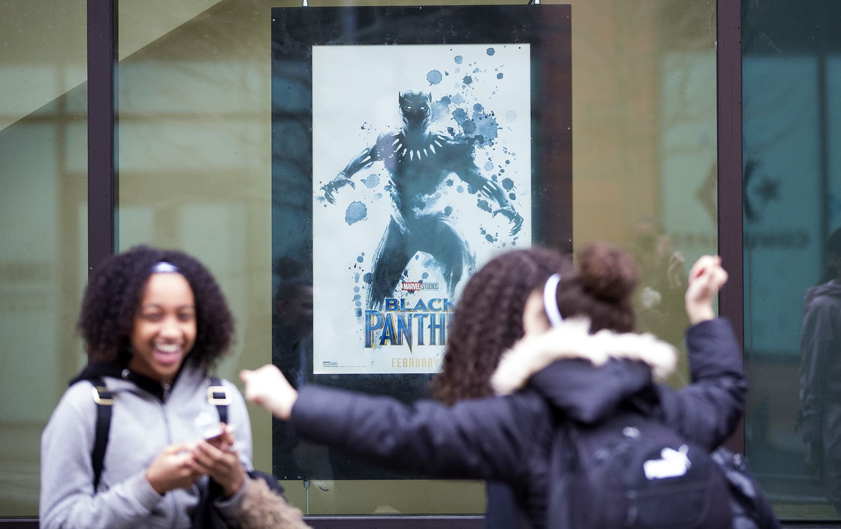 Students from the New Mission High School in Hyde Park line up to attend a private screening of &quot;Black Panther&quot; at the South Bay AMC Theater. (Jesse Costa/WBUR)