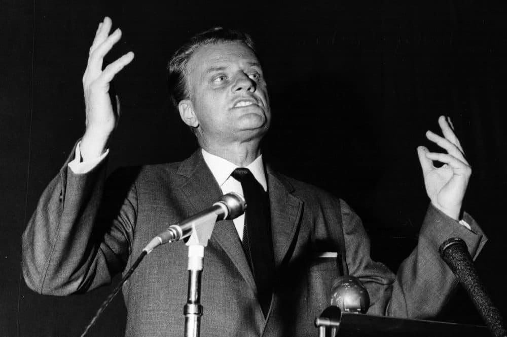 Billy Graham preaching at one of his rallies in 1966. (Evening Standard/Getty Images)