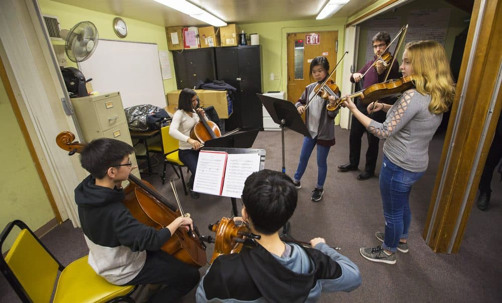 Boston String Academy students and teachers rehearse together at the Boston Chinese Evangelical Church in Chinatown. (Jesse Costa/WBUR)