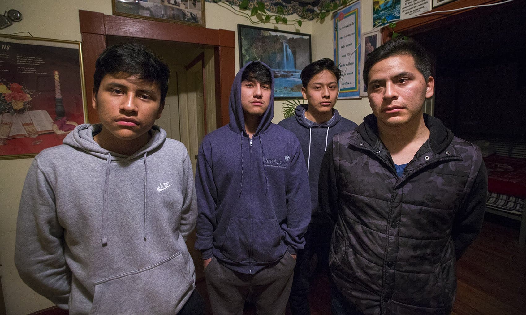 From left, the Macario brothers: Saul, 16, Erwin, 21, Anthony, 18, and Isidro, 27. Unlike his brothers, Isidro was not born in the U.S. and was deported to Guatemala on Wednesday. (Jesse Costa/WBUR)
