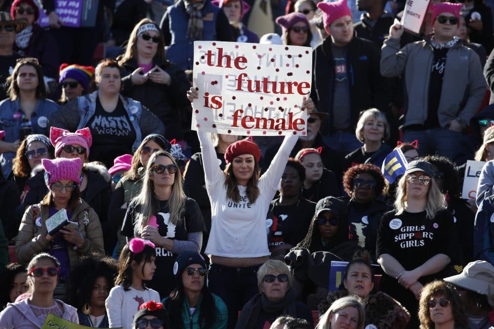 People cheer during a women's march rally Sunday, Jan. 21, 2018, in Las Vegas. (John Locher/AP)