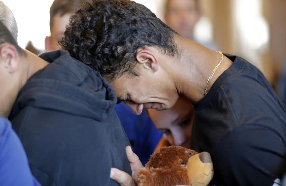 Austin Burden, 17, cries on the shoulder of a friend after a vigil at the Parkland Baptist Church, for the victims of the Wednesday shooting at Marjory Stoneman Douglas High School, in Parkland, Fla., Thursday, Feb. 15, 2018. Nikolas Cruz, a former student, was charged with 17 counts of premeditated murder on Thursday. (Gerald Herbert/AP)