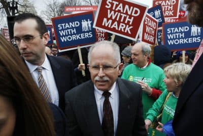 Illinois government employee Mark Janus, center, turns after thanking supporters outside the Supreme Court, Monday, Feb. 26, 2018, in Washington. The Supreme Court takes up a challenge Monday in a case that could deal a painful financial blow to organized labor. The court is considering a challenge to an Illinois law that allows unions representing government employees to collect fees from workers who choose not to join. (AP Photo/Jacquelyn Martin)