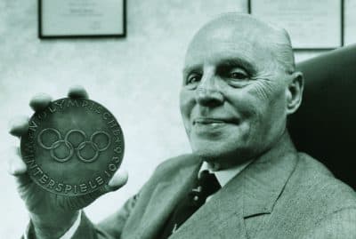 Francis Baker, pictured here in 1992 with his Olympic medal, found himself in Germany when the U.S. hockey team needed a reserve goalie. (Courtesy Hamilton College)