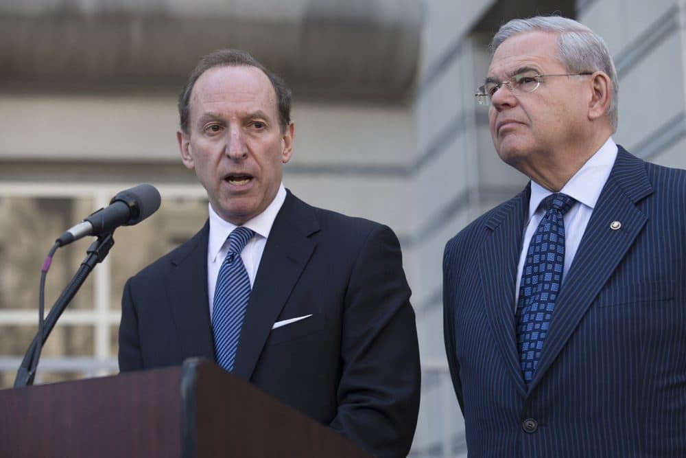 Attorney Abbe Lowell speaks alongside U.S. Sen. Bob Menendez after leaving the Martin Luther King Jr. Federal Courthouse following his client's arraignment, Thursday, April 2, 2015, in Newark, N.J.  (AP Photo/John Minchillo)