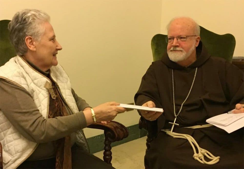 Marie Collins hands the letter written by Juan Carlos Cruz to Cardinal Sean O'Malley in April 2015. (Courtesy of Catherine Bonnet)