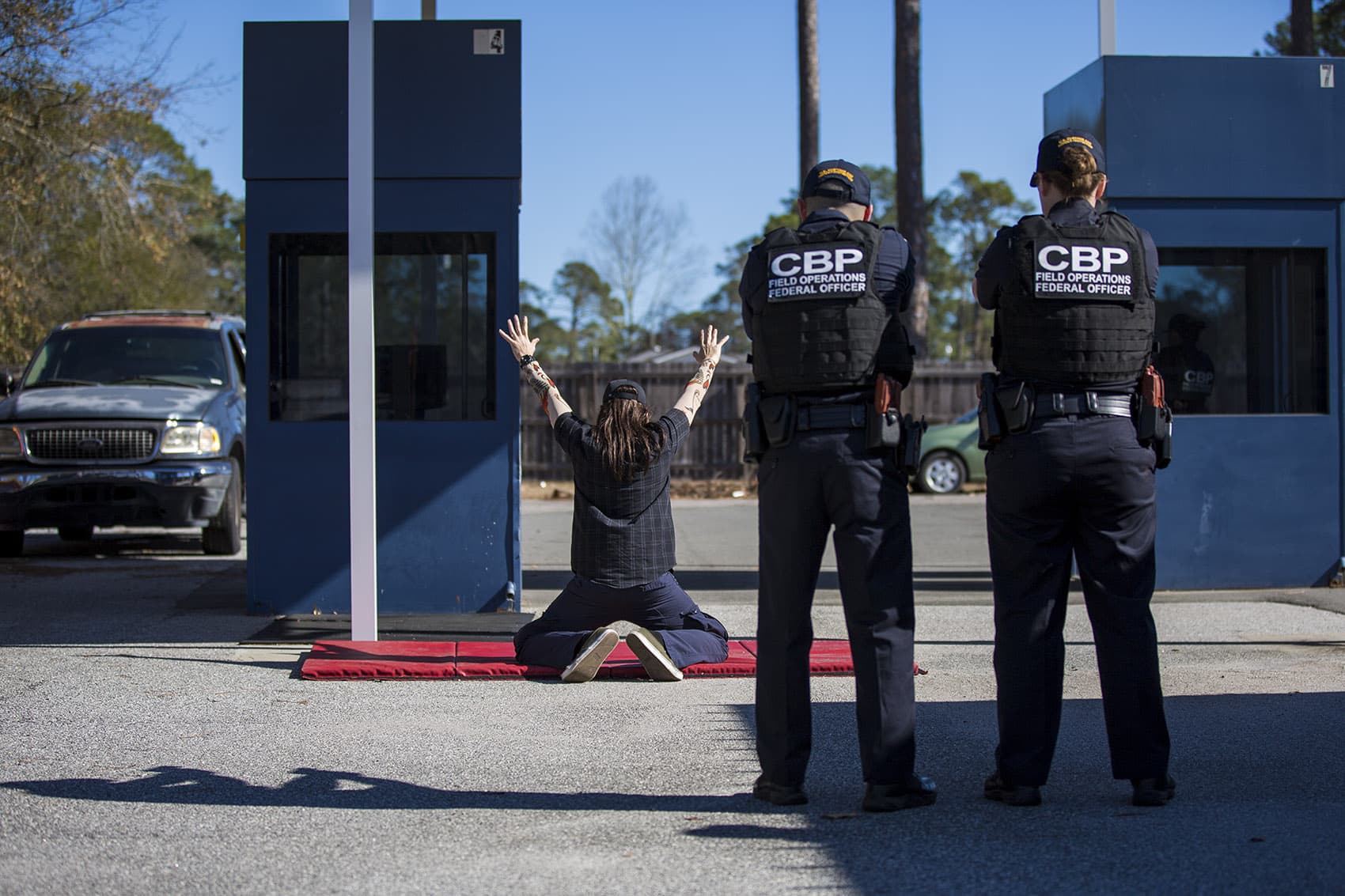 At the federal law enforcement training center in Brunswick, Georgia, U.S. Customs and Border Protection officer trainees conduct a border crossing drill. (Jesse Costa/WBUR)