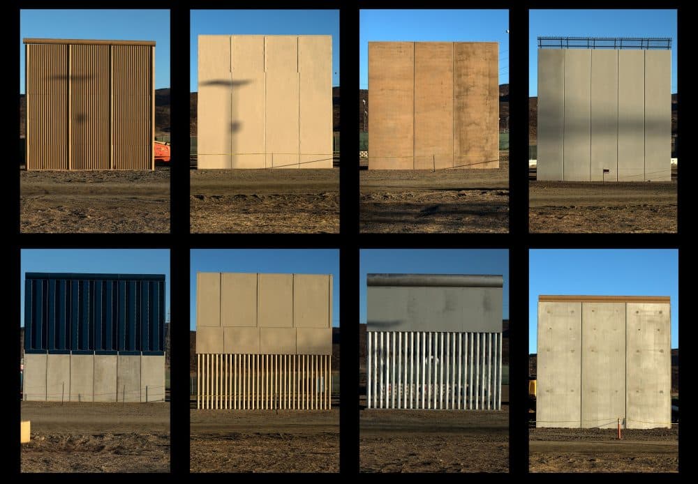 This combination of pictures shows the eight prototypes of President Trump's U.S.-Mexico border wall being built near San Diego, in the U.S., seen from across the border from Tijuana, Mexico, on Oct. 22, 2017. (Guillermo Arias/AFP/Getty Images)