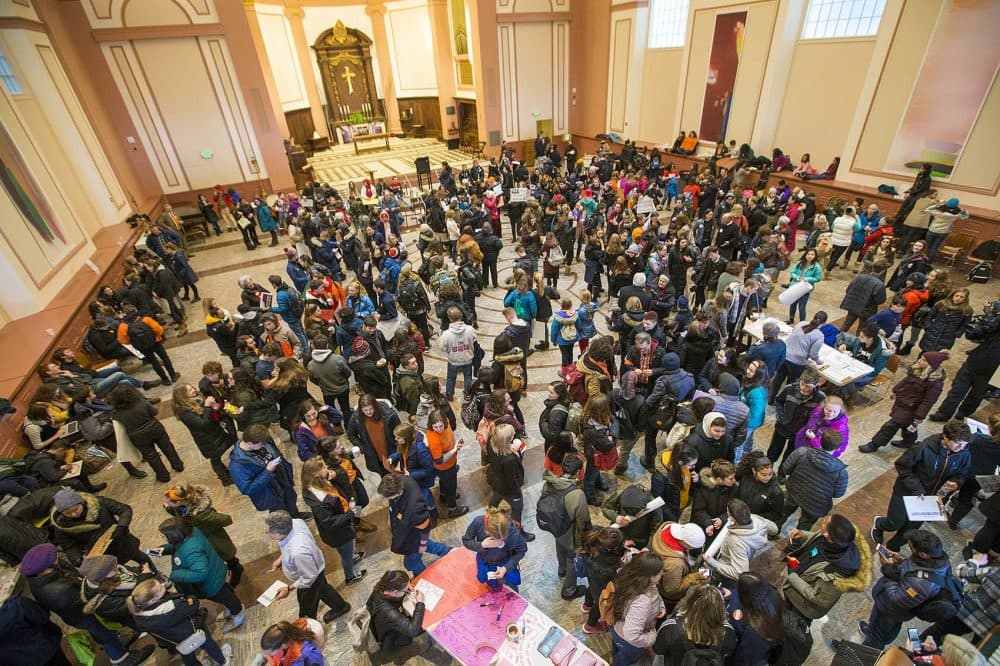Boston-area students gather at St. Paul's Cathedral on Tremont Street in Boston prior to marching to the State House to meet with legislators. (Jesse Costa/WBUR)