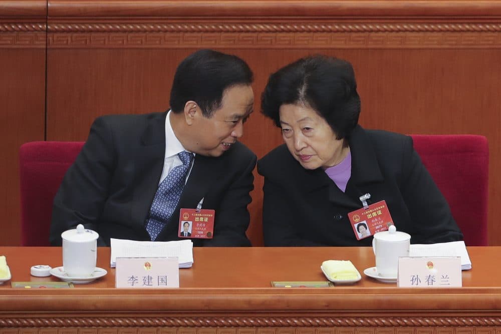 Vice chairman of the Standing Committee of the National People's Congress Li Jianguo (left) talks with Sun Chunlan, head of the United Front Work Department of the Communist Party of China Central Committee, at the Third Plenary Session of the Fifth Session of the 12th National People's Congress (NPC) at the Great Hall of the People on March 12, 2017 in Beijing. (Lintao Zhang/Getty Images)