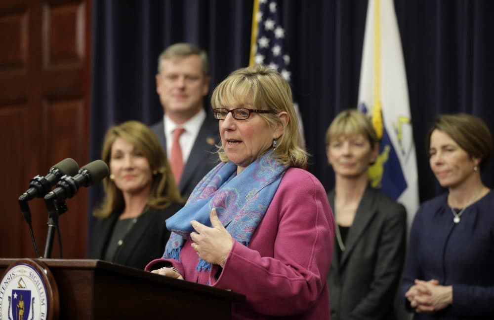 Then-Senate Ways and Means Chair Karen Spilka, center, speaks before reporters as Mass. Lt. Gov. Karyn Polito, left, Mass. Gov. Charlie Baker, second from left, Mass. Secretary of Health and Human Services Marylou Sudders, second from right, and Mass. Attorney General Maura Healey, right, look on on Jan. 25, 2016. (Steven Senne/AP)