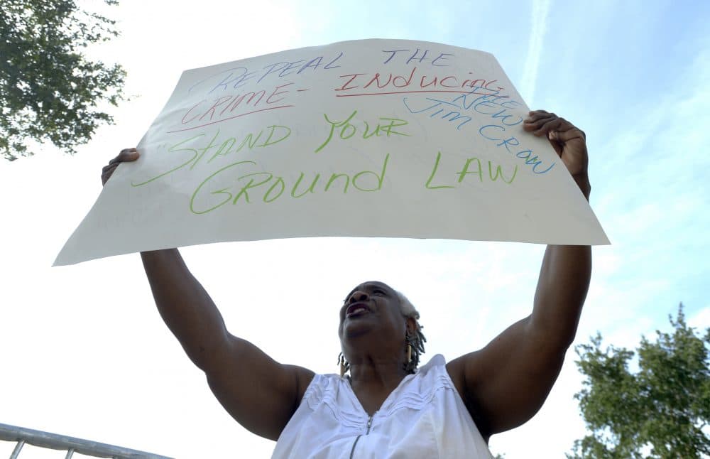 Barbara Jackson, of Sanford, Fla., protests outside the Seminole County Courthouse during the George Zimmerman trial Tuesday, June 11, 2013, in Sanford. (Phelan M. Ebenhack/AP)