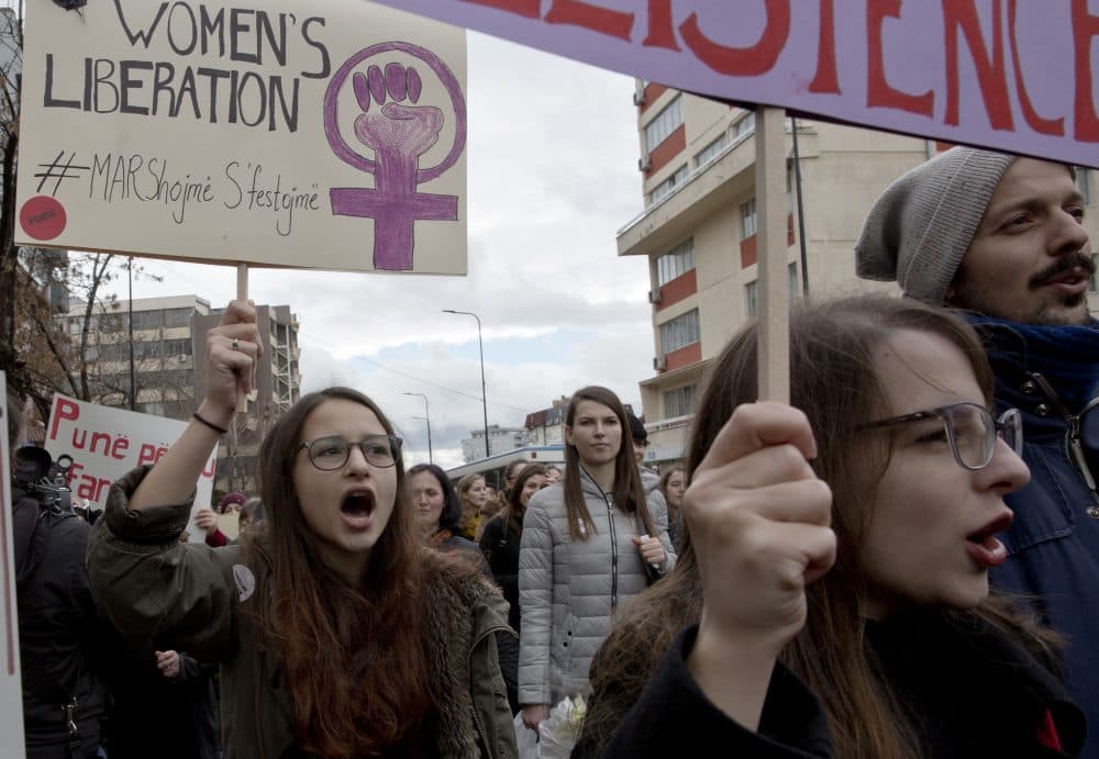 Demonstrators attend a march to commemorate International Women's Day, in the Kosovo capital Pristina, Thursday, March 8, 2018. (AP Photo/Visar Kryeziu)