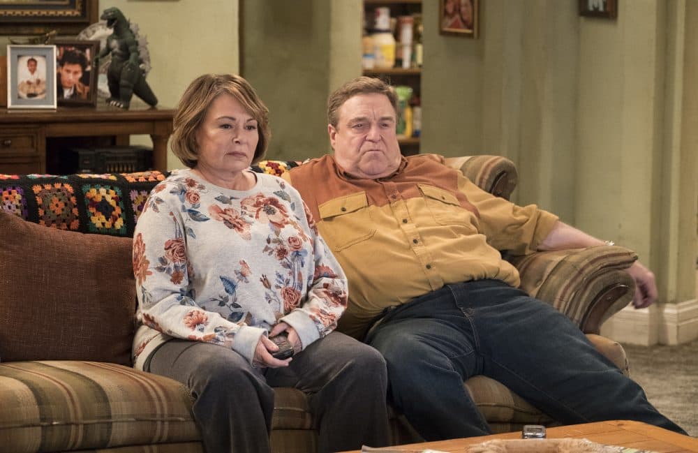 In this image released by ABC, Roseanne Barr, left, and John Goodman appear in a scene from the reboot of &quot;Roseanne.&quot; (Adam Rose/ABC via AP)