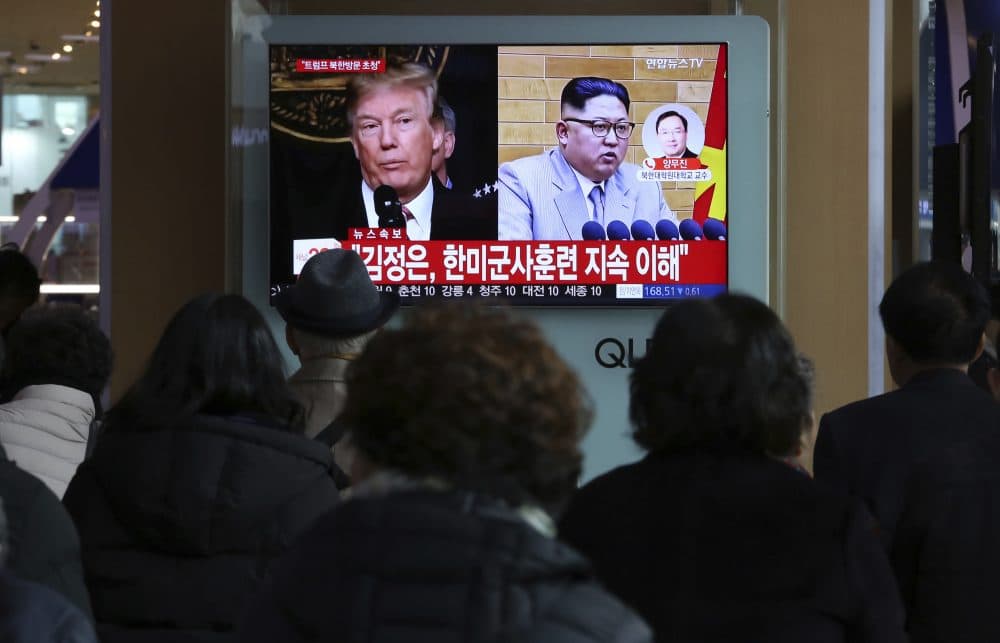 People watch a TV screen showing North Korean leader Kim Jong Un and U.S. President Donald Trump, left, at the Seoul Railway Station in Seoul, South Korea, Friday, March 9, 2018. After months of trading insults and threats of nuclear annihilation, Trump agreed to meet with North Korean leader Kim Jung Un by the end of May to negotiate an end to Pyongyang's nuclear weapons program, South Korean and U.S. officials said Thursday. No sitting American president has ever met with a North Korea leader. The signs read: &quot; Kim Jong Un understands that the routine joint military exercises between the South Korean and the United States must continue.&quot; (Ahn Young-joon/AP)