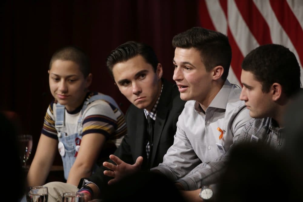 Marjory Stoneman Douglas High School students and mass shooting survivors, from the left, Emma Gonzalez, David Hogg, Cameron Kasky and Alex Wind participate in a panel discussion about guns, Tuesday at Harvard Kennedy School's Institute of Politics. (Steven Senne/AP)
