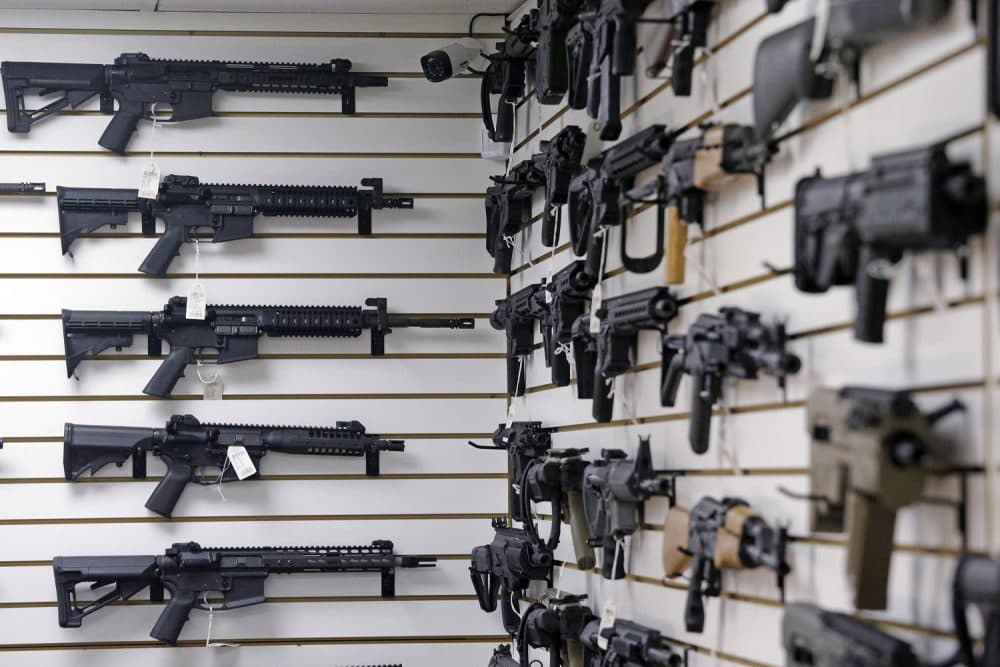 Dozens of semi-automatic rifles line a pair of walls in a gun shop Tuesday, Nov. 7, 2017, in Lynnwood, Wash. (AP Photo/Elaine Thompson)