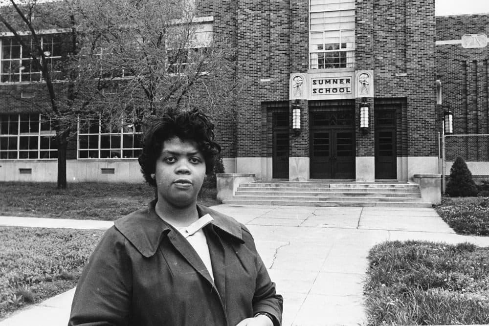 FILE - This May 8, 1964 file photo shows Linda Brown Smith standing in front of the Sumner School in Topeka, Kansas. The refusal of the public school to admit Brown in 1951, then nine years old, because she is black, led to the Brown v. Board of Education of Topeka, Kansas. In 1954, the U.S. Supreme Court overruled the &quot;separate but equal&quot; clause and mandated that schools nationwide must be desegregated.  (AP Photo, File)