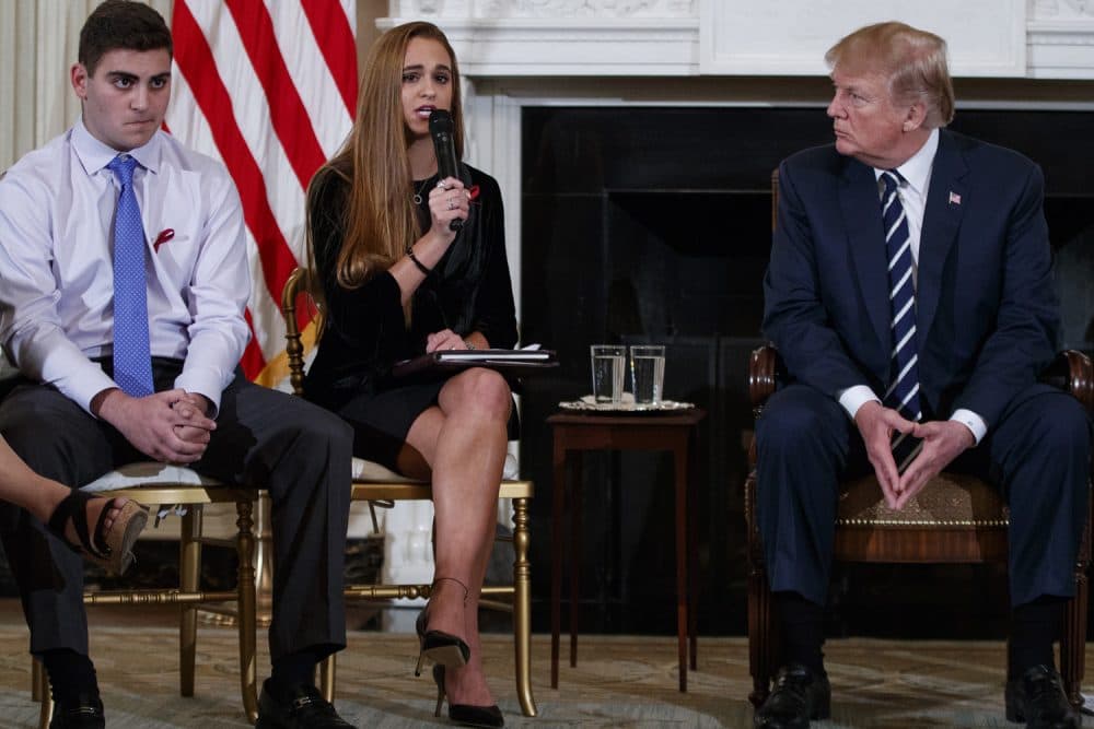 From left, Marjory Stoneman Douglas High School student Jonathan Blank, Julia Cordover, the student body president at Marjory Stoneman Douglas High School, President Donald Trump, participate in a listening session with high school students, teachers, and others in the State Dining Room of the White House in Washington, Wednesday, Feb. 21, 2018. (AP Photo/Carolyn Kaster)