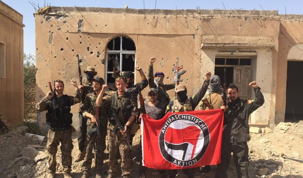 Caleb Stevens (fourth from left) in Raqqa with other politically motivated members of his unit. (Courtesy Caleb Stevens)