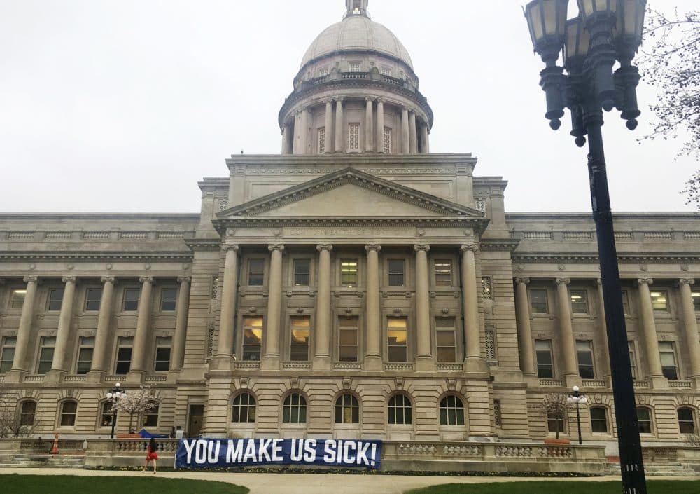 A sign hangs from the Kentucky Capitol on Monday, April 2, 2018, in Frankfort, Ky. Teachers and other public workers are expected to protest recent changes to the pension system and a two-year spending plan lawmakers could approve Monday. (Adam Beam/AP)