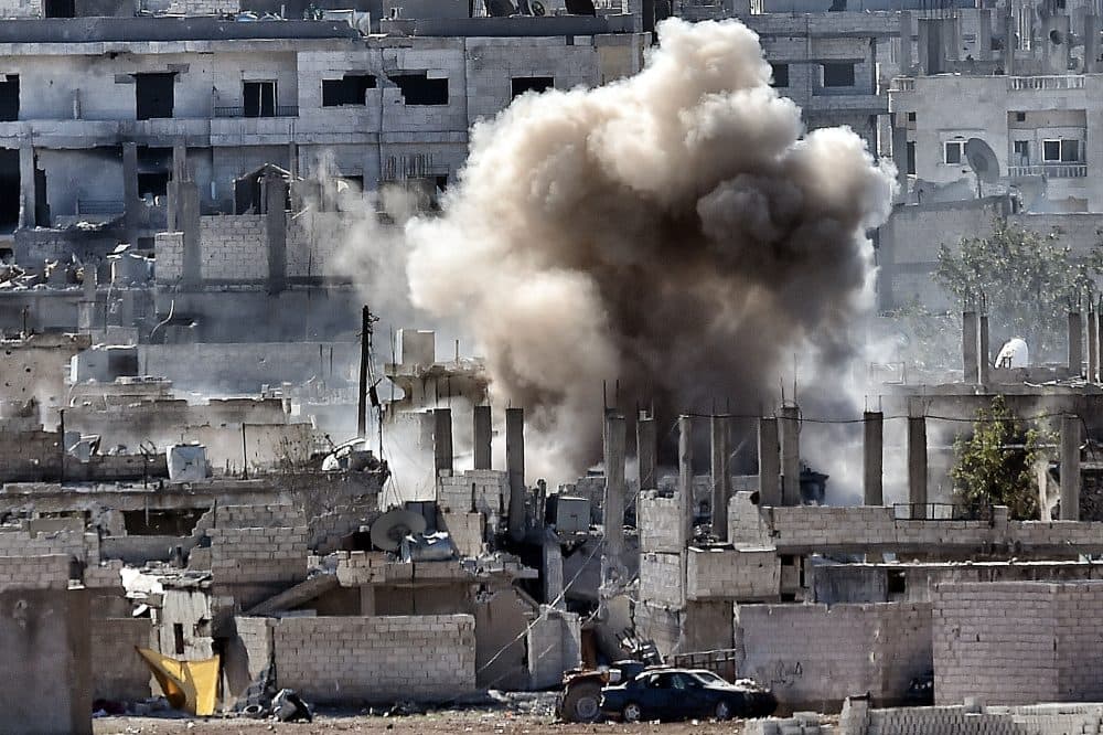 Smoke rises during a shelling by Islamic State militants to the Syrian city of Kobane, also known as Ain al-Arab on Nov. 6, 2014 from the Turkish city of Mursitpinar. (Aris Messinis/AFP/Getty Images)