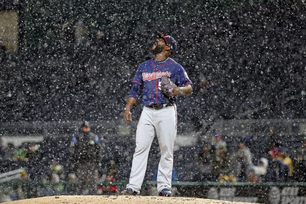 An unusual April sight: baseball in the snow. (Gene J. Puskar/AP)