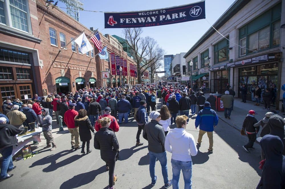 Red Sox fans line up outside the turnstiles on Yawkey Way on Opening Day at Fenway Park. (Jesse Costa/WBUR)