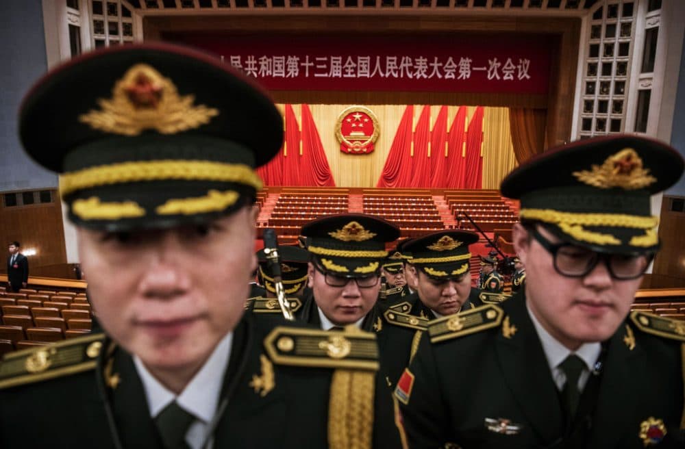 Members of a band from the People's Liberation Army leave following a speech by China's President Xi Jinping after the closing session of the National People's Congress at The Great Hall Of The People on March 20, 2018 in Beijing, China. The annual gathering of Chinese lawmakers concluded with a nationalistic speech by president Xi Jinping, his first public address since the abolishment of term limits marked the beginning of his indefinite rule. Xi spoke confidently of China's determination to take its place in the world, and gave the strongest sign in decades that the Communist government wants to bring Taiwan back under Beijing's control. Xi warned that China would never allow &quot;one inch&quot; of territory to be separated from it, and said any attempts to split China will receive &quot;the punishment of history.&quot; The denunciation appeared to be aimed at the United States, after U.S. President Donald Trump signed the Taiwan Travel Act this week that allows high-level U.S. visits to Taiwan. (Kevin Frayer/Getty Images)