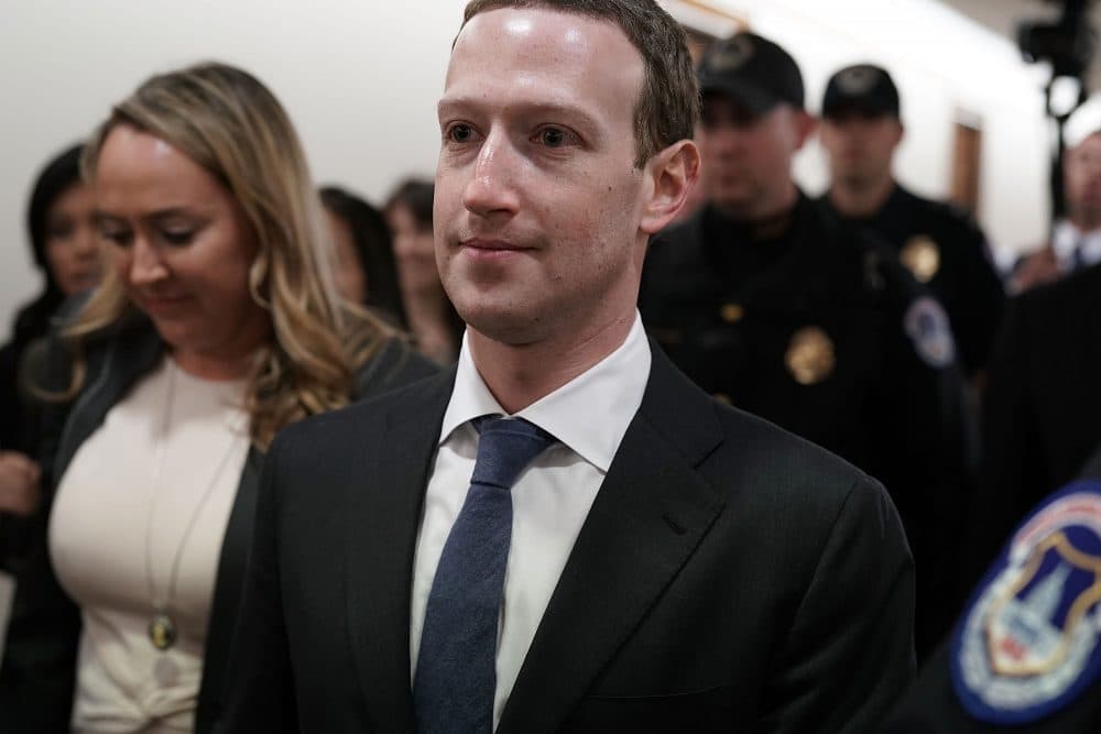 Facebook CEO Mark Zuckerberg is escorted by U.S. Capitol Police as he walks in a hallway prior to a meeting with U.S. Sen. John Thune (R-S.D.), committee chairman of Senate Committee on Commerce, Science, and Transportation, April 9, 2018 on Capitol Hill in Washington, D.C. (Alex Wong/Getty Images)