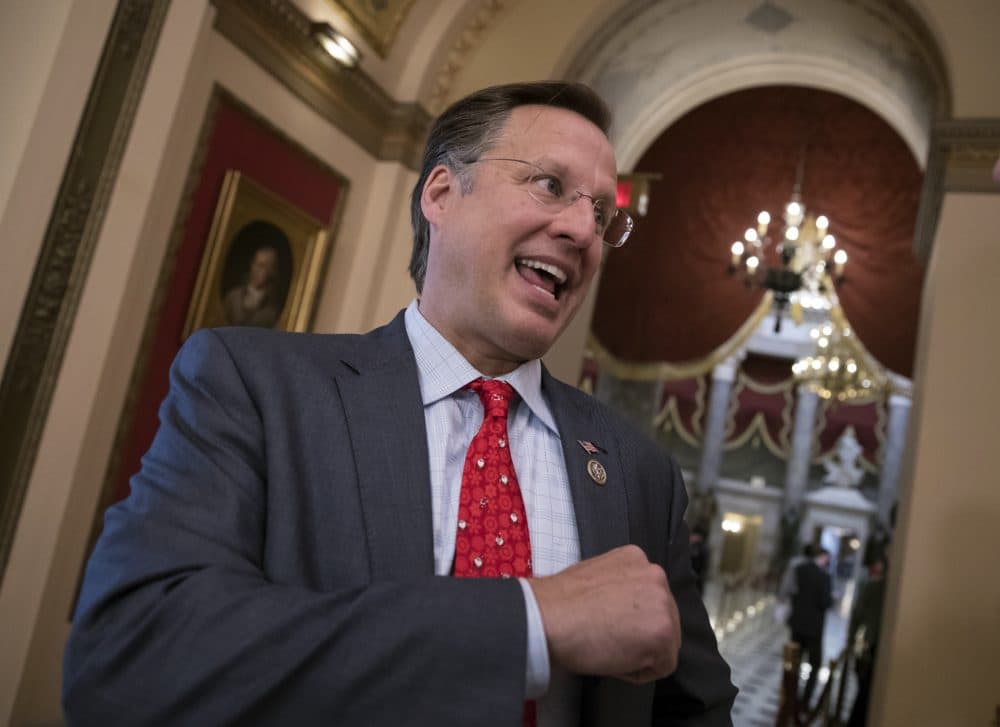 Rep. Dave Brat, R-Va., a member of the conservative House Freedom Caucus, speaks with a reporter just before passage of the Republican tax reform bill in the House of Representatives, on Capitol Hill, in Washington, Tuesday, Dec. 19, 2017. (J. Scott Applewhite/AP)