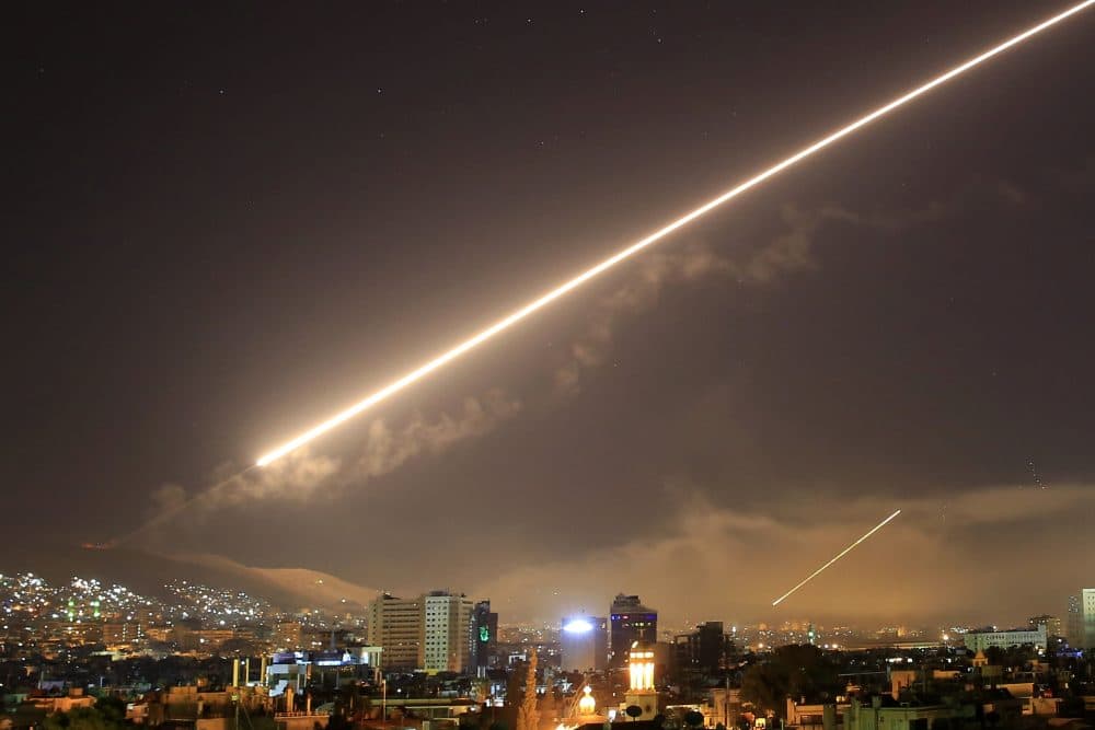 Damascus skies erupt with surface to air missile fire as the U.S. launches an attack on Syria early Saturday, April 14, 2018. (Hassan Ammar/AP)