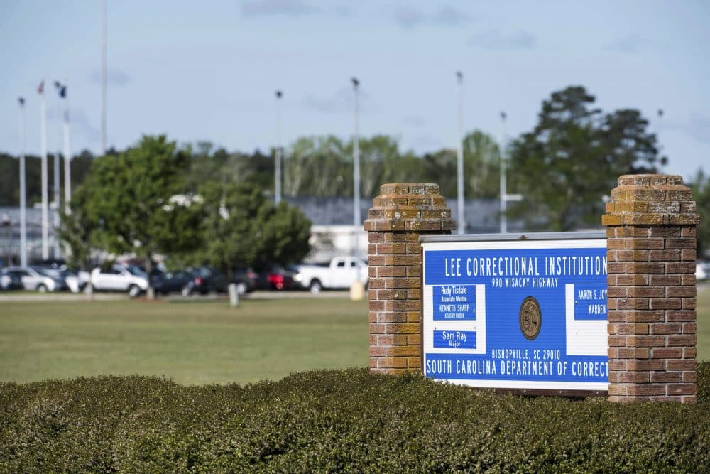A sign sits outside the Lee Correctional Institution on Monday, April 16, 2018, in Bishopville, S.C. Multiple inmates were killed and others seriously injured amid fighting between prisoners inside the maximum security prison in South Carolina. (AP Photo/Sean Rayford)