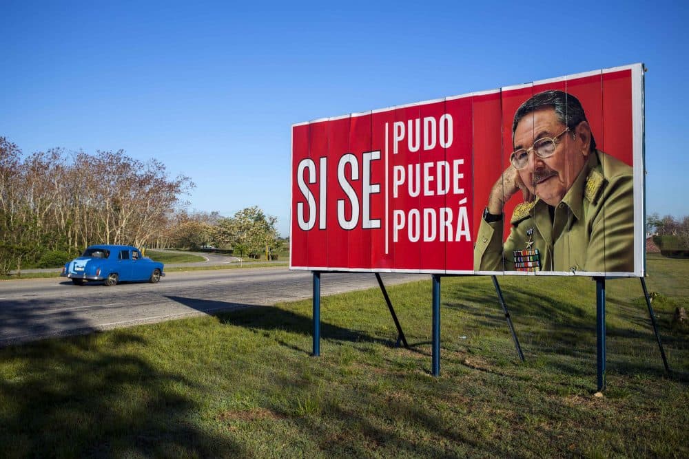 A car drives by a billboard that reads in Spanish &quot;It was, is and will be done&quot; with a picture of Cuba's President Raul Castro on the outskirts of Havana, Cuba, Wednesday, April 18, 2018. Cuba's legislature opened the two-day session that is to elect a successor to President Castro. (Desmond Boylan/AP)