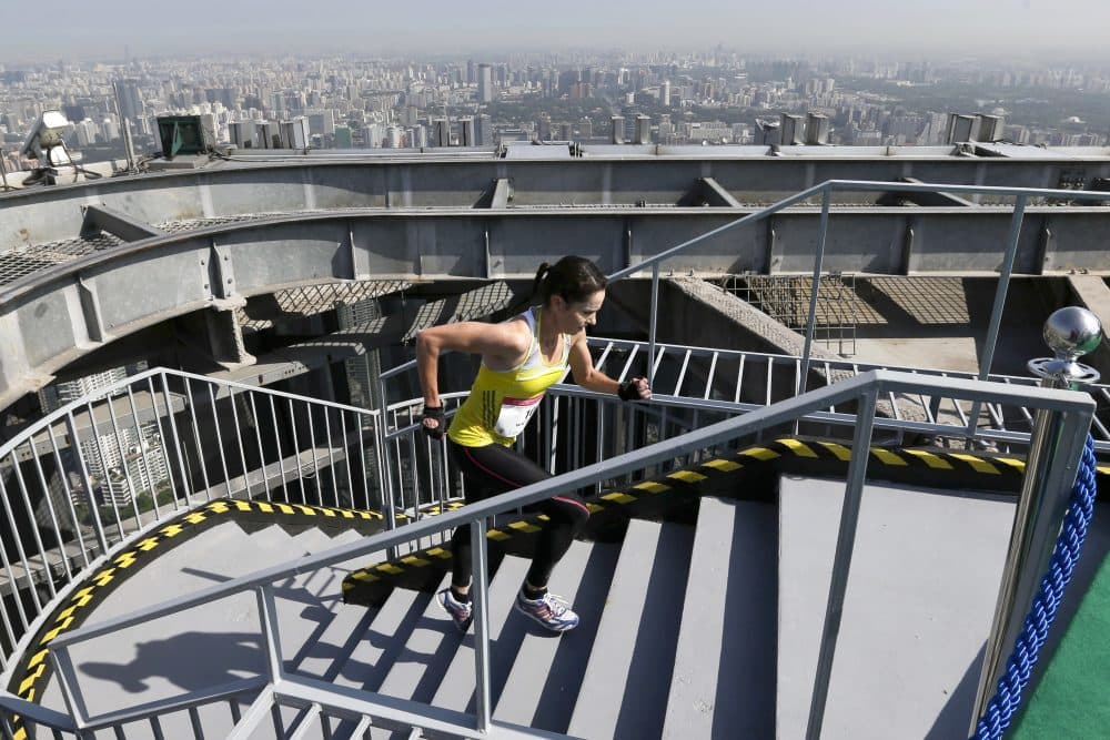 Suzy Walsham transitioned to vertical running after injuries derailed her track career. Now she's the world's top-ranked women's vertical runner. (Alexander F. Yuan/AP)